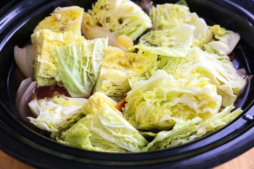 Put raw cabbage wedges in a slow cooker with these 3 ingredients Put raw cabbage wedges in a slow cooker with these 3 ingredients