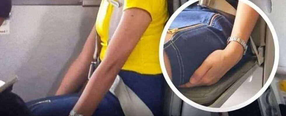 Here’s Why Flight Attendants Sit On Their Hands During Takeoff and Landing
