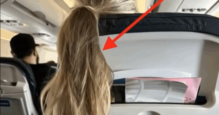 A girl on the plane threw her hair over my seat, blocking my screen